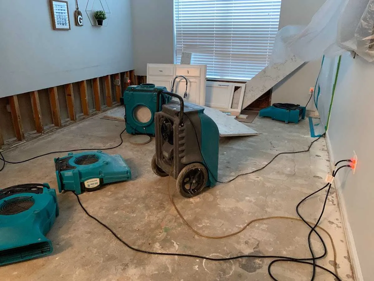 Dehumidifier in flood-cut room for Water Damage Restoration in Port Washington
